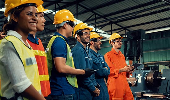 workers in a row on a factory shop floor