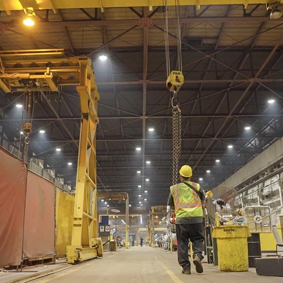 worker walking a factory floor